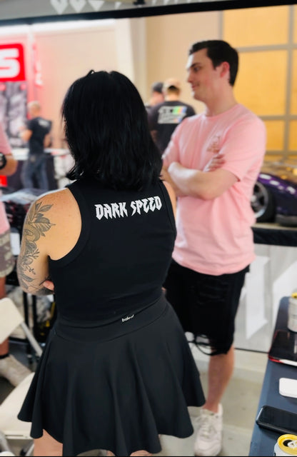 Dark speed crop top that is black and razorback. On the front it has our circle logo and on the back it has Dark Speed. ￼